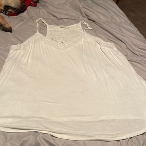 Maurice’s white tank